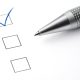 pen and paper with check boxes